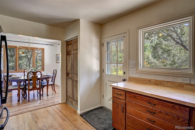 4665 Fox Rd, Cascade, CO 80809 - kitchen with wooden counters, light wood finished floors, and brown cabinetry