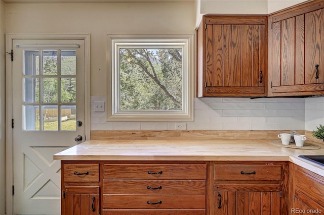 4665 Fox Rd, Cascade, CO 80809 - kitchen with wooden counters, tasteful backsplash, and brown cabinetry