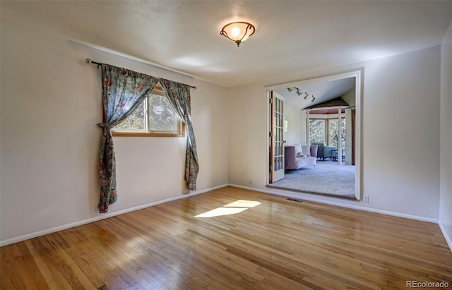 4665 Fox Rd, Cascade, CO 80809 - spare room with wood finished floors and lofted ceiling
