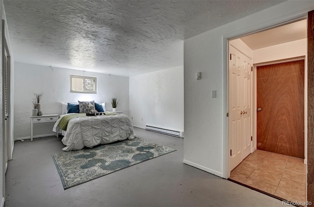 4665 Fox Rd, Cascade, CO 80809 - bedroom featuring a baseboard radiator, concrete floors, and a textured ceiling