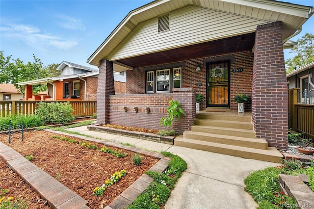 3611 N Vine St, Denver, CO 80205 - view of front of house featuring brick siding and a porch