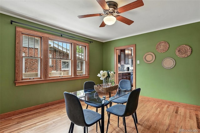 3611 N Vine St, Denver, CO 80205 - dining area featuring light wood-type flooring, baseboards, a ceiling fan, and ornamental molding