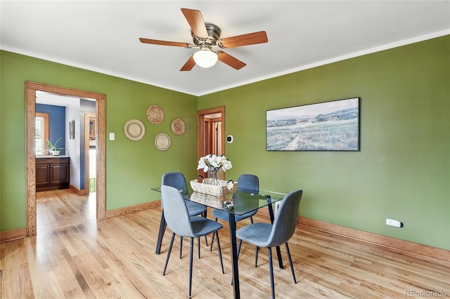 3611 N Vine St, Denver, CO 80205 - dining space with light wood-type flooring, crown molding, ceiling fan, and baseboards