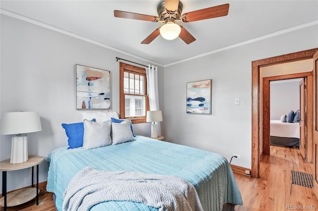 3611 N Vine St, Denver, CO 80205 - bedroom with baseboards, light wood-type flooring, crown molding, and a ceiling fan