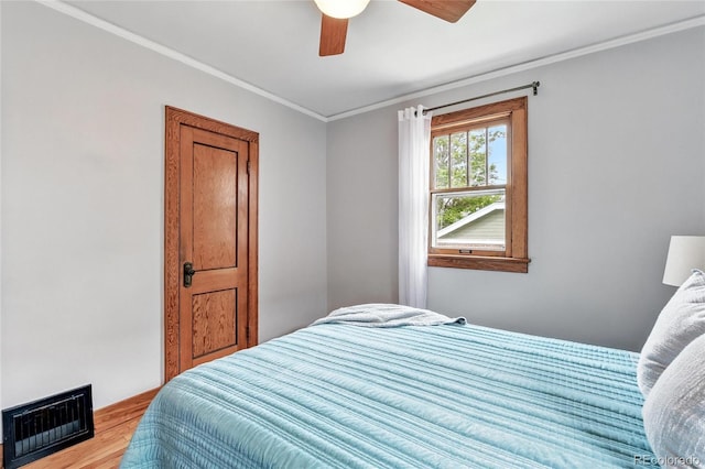 3611 N Vine St, Denver, CO 80205 - bedroom featuring wood finished floors, ornamental molding, and ceiling fan
