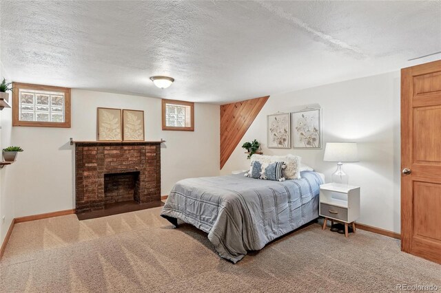 3611 N Vine St, Denver, CO 80205 - carpeted bedroom with a textured ceiling, baseboards, and a brick fireplace