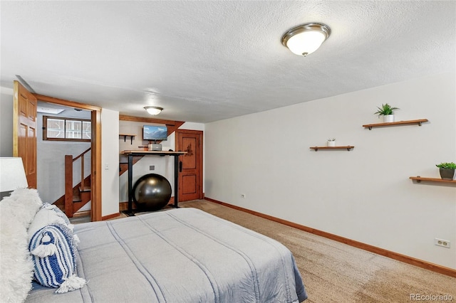 3611 N Vine St, Denver, CO 80205 - bedroom with a textured ceiling, baseboards, and light carpet