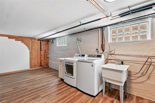 3611 N Vine St, Denver, CO 80205 - washroom with washing machine and dryer and light wood-style flooring