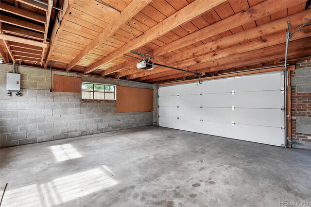 3611 N Vine St, Denver, CO 80205 - garage with a garage door opener and concrete block wall