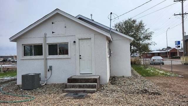 rear view of house with central AC