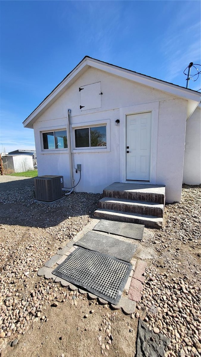 back of property with cooling unit