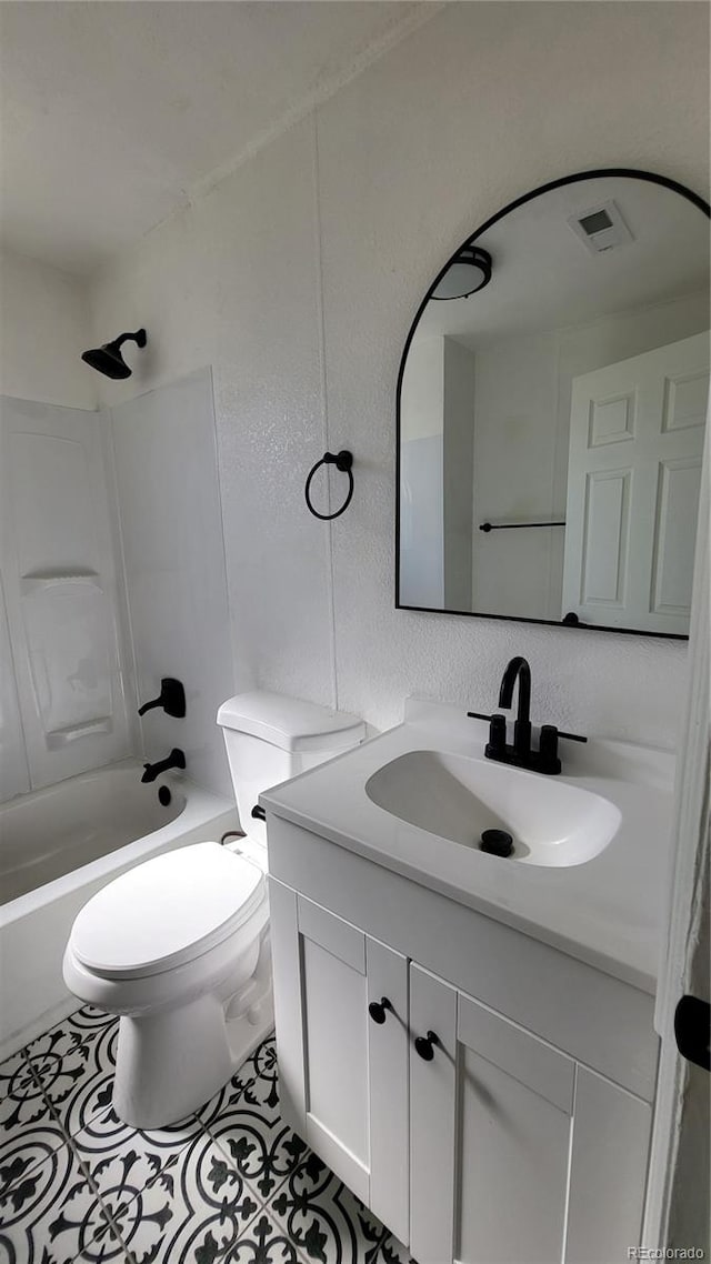 full bathroom featuring tile patterned flooring, vanity,  shower combination, and toilet