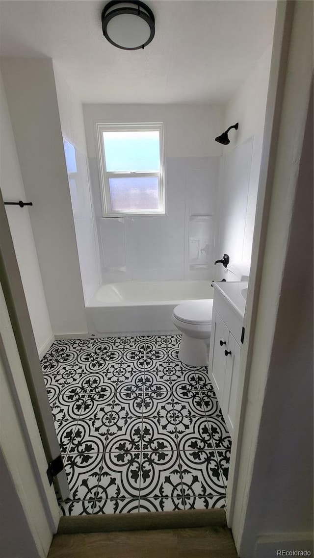 full bathroom featuring tile patterned flooring, vanity, toilet, and shower / bathing tub combination