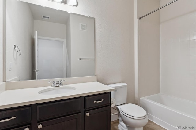 full bathroom with toilet, vanity, and bathtub / shower combination