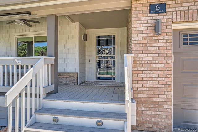 entrance to property featuring ceiling fan and covered porch