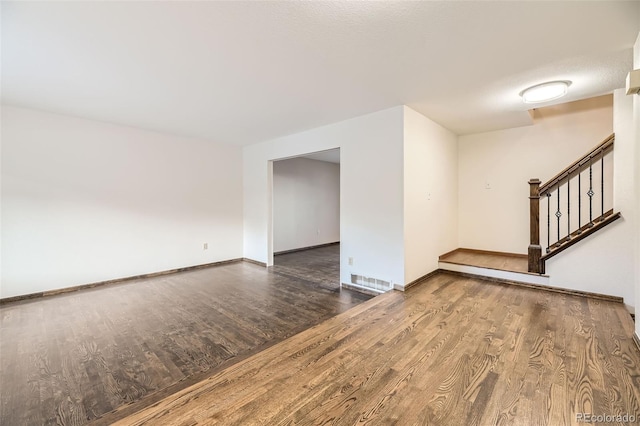 unfurnished room featuring hardwood / wood-style flooring