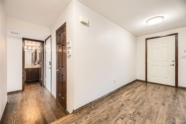 hallway with wood-type flooring