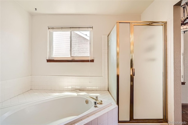 bathroom with shower with separate bathtub