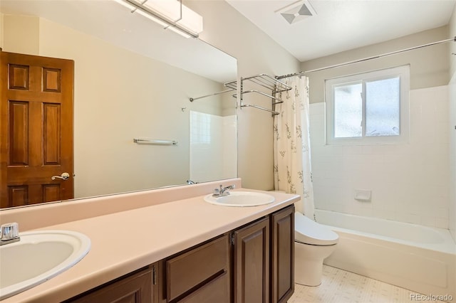 full bathroom featuring vanity, toilet, and shower / tub combo