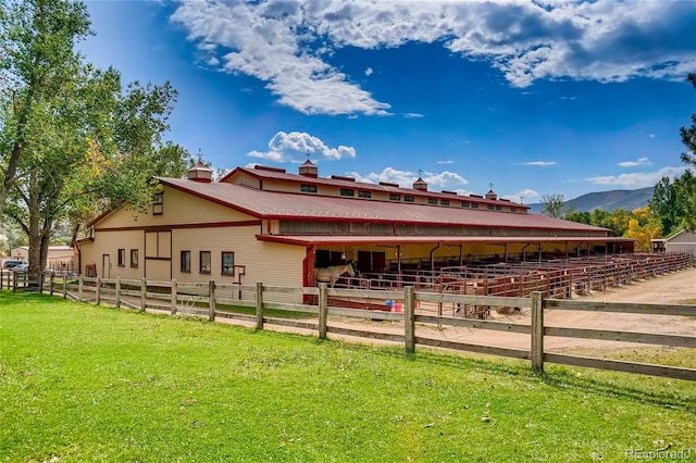 view of horse barn featuring a mountain view