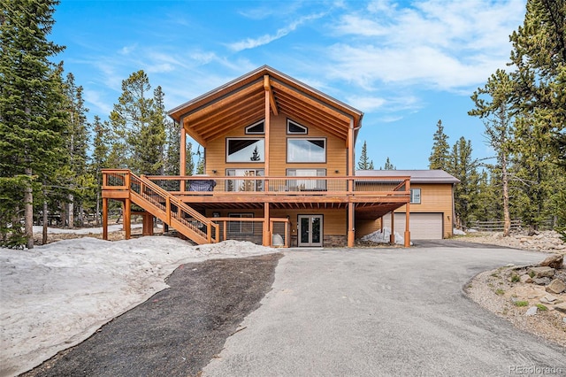 423 Prunes Pl, Fairplay, CO 80440 - view of front of house featuring a wooden deck, french doors, driveway, and stairway