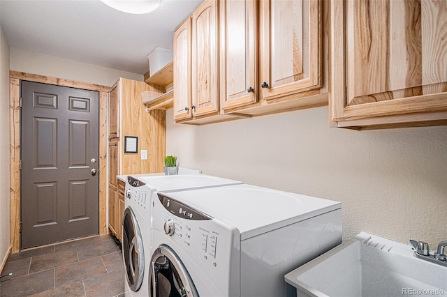 423 Prunes Pl, Fairplay, CO 80440 - laundry area featuring independent washer and dryer, cabinet space, and dark stone finish flooring