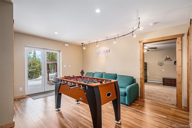 423 Prunes Pl, Fairplay, CO 80440 - playroom with a baseboard radiator, track lighting, light wood finished floors, a ceiling fan, and recessed lighting