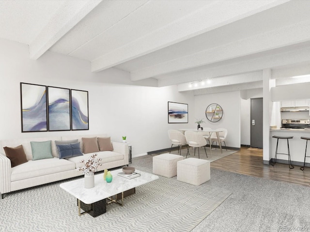 living room featuring hardwood / wood-style floors, beam ceiling, and a textured ceiling