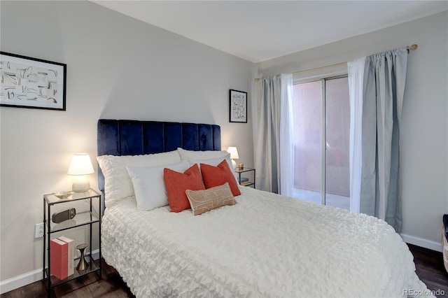 bedroom with dark wood-type flooring, multiple windows, and baseboards