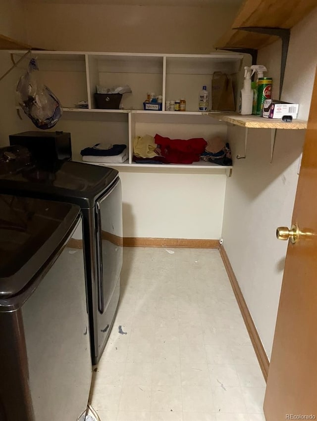 laundry room with separate washer and dryer