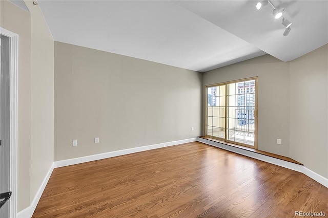 300 W 11th Ave Unit 8C, Denver, CO 80204 - spare room with wood finished floors and rail lighting
