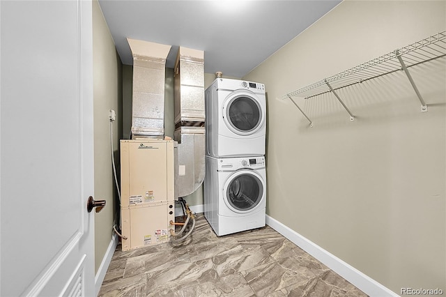 300 W 11th Ave Unit 8C, Denver, CO 80204 - laundry area featuring stacked washing machine and dryer, marble finish flooring, and heating unit