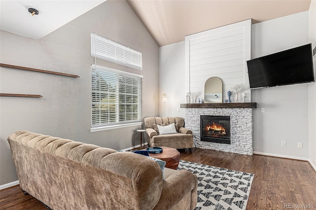 living room with lofted ceiling, a fireplace, and dark hardwood / wood-style floors