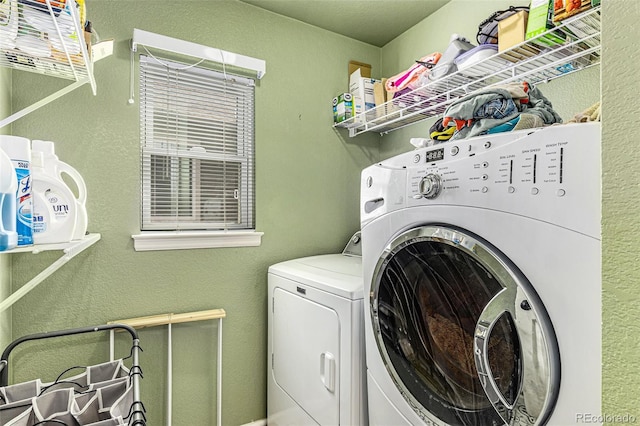 laundry area with independent washer and dryer