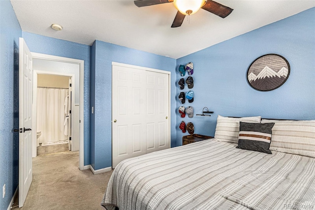 carpeted bedroom with ceiling fan and a closet