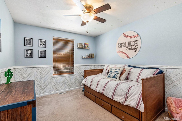 carpeted bedroom with ceiling fan