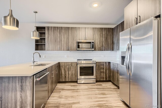 20 Wilcox St Unit 316, Castle Rock, CO 80104 - kitchen featuring stainless steel appliances, a sink, open shelves, and backsplash
