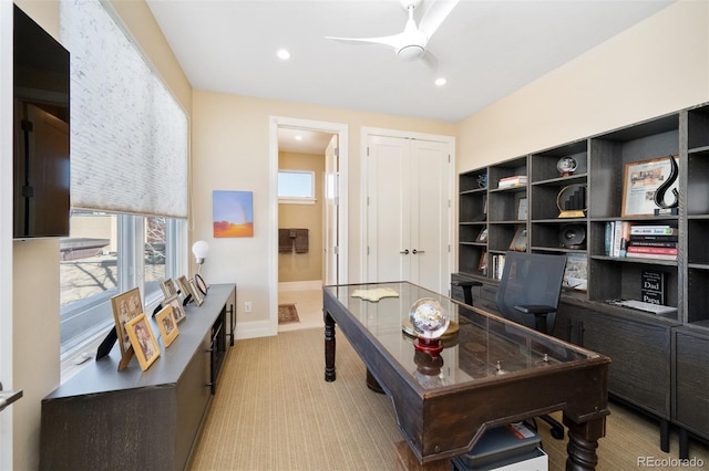 home office with light colored carpet and ceiling fan