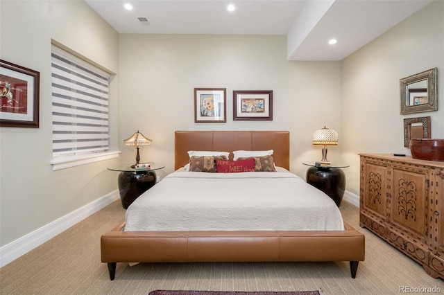 bedroom with light colored carpet