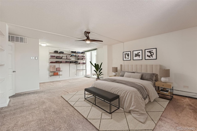 bedroom with light carpet, a textured ceiling, and ceiling fan