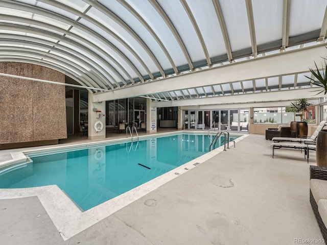 community pool featuring a patio area and outdoor lounge area