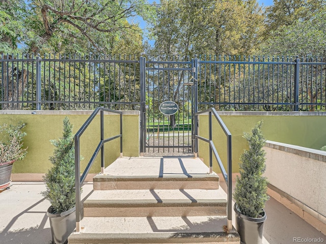 view of gate featuring fence