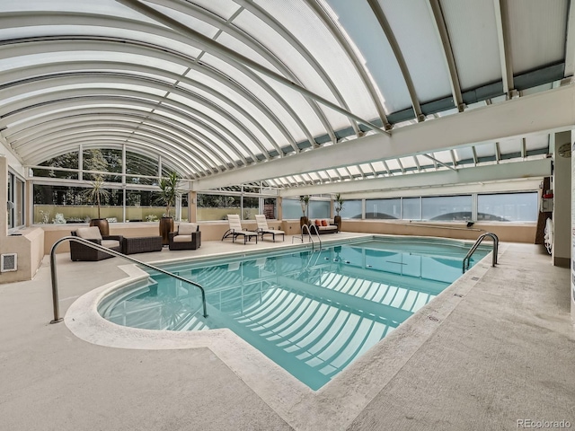 community pool featuring a patio area and outdoor lounge area