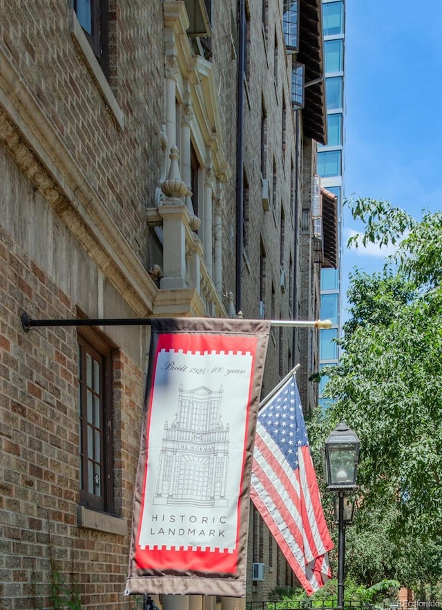 99 S Downing St Unit 105, Denver, CO 80209 - view of side of property featuring brick siding