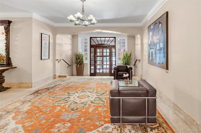 99 S Downing St Unit 105, Denver, CO 80209 - foyer with crown molding, arched walkways, and a chandelier