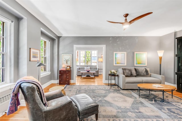 99 S Downing St Unit 105, Denver, CO 80209 - living room with light wood-style floors and a ceiling fan