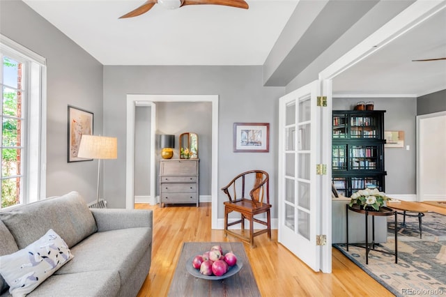 99 S Downing St Unit 105, Denver, CO 80209 - living area featuring ceiling fan, wood finished floors, and french doors