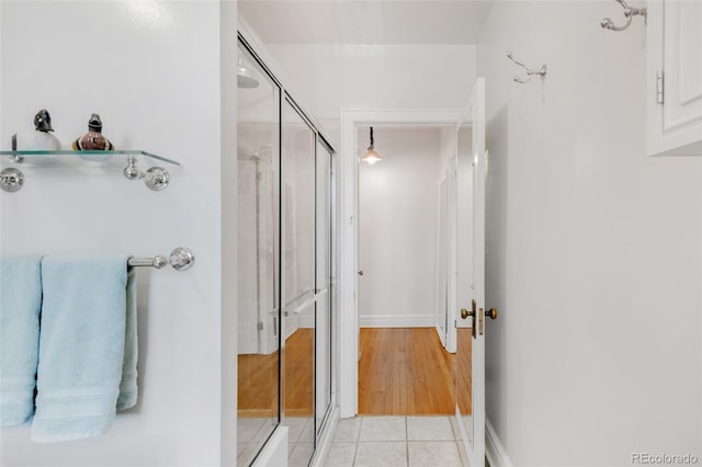 99 S Downing St Unit 105, Denver, CO 80209 - full bath featuring a shower stall and tile patterned flooring