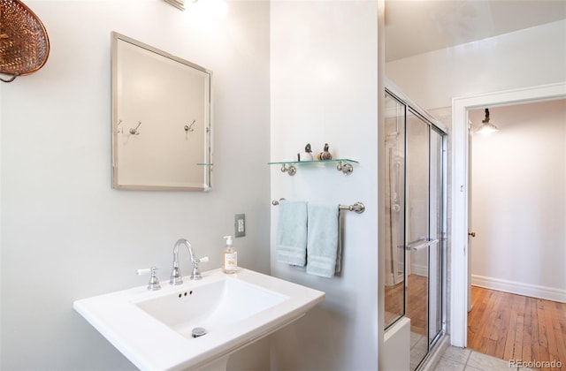 99 S Downing St Unit 105, Denver, CO 80209 - full bath with a stall shower and tile patterned flooring