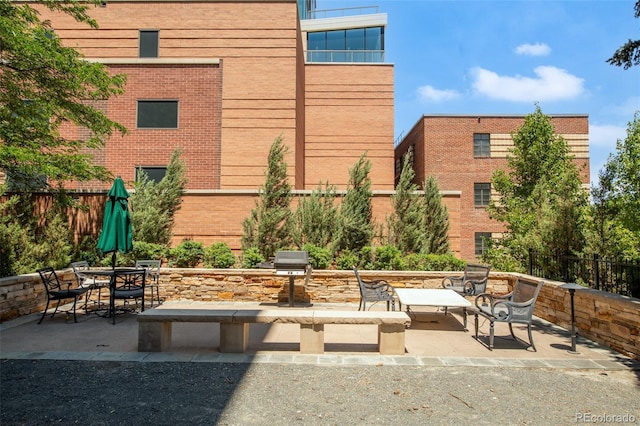 99 S Downing St Unit 105, Denver, CO 80209 - view of patio with outdoor dining space and a grill